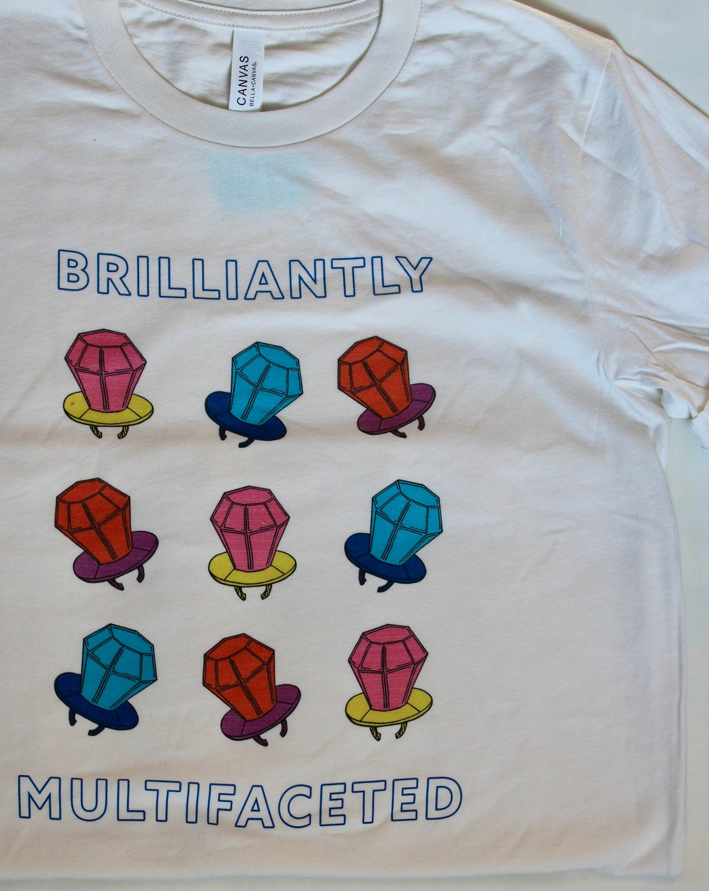 White t-shirt with colorful ring pop design