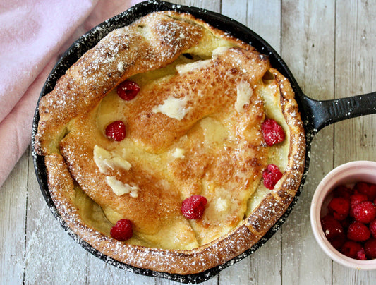 DUTCH BABY WITH HONEY BUTTER AND RASPBERRIES