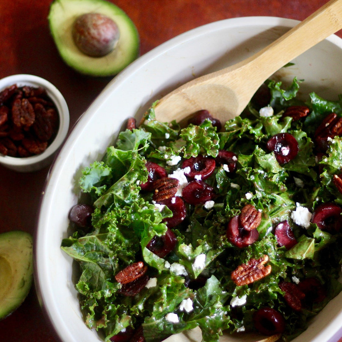 KALE SALAD WITH AVOCADO BALSAMIC DRESSING, CHERRIES AND SWEET AND SPICY PECANS