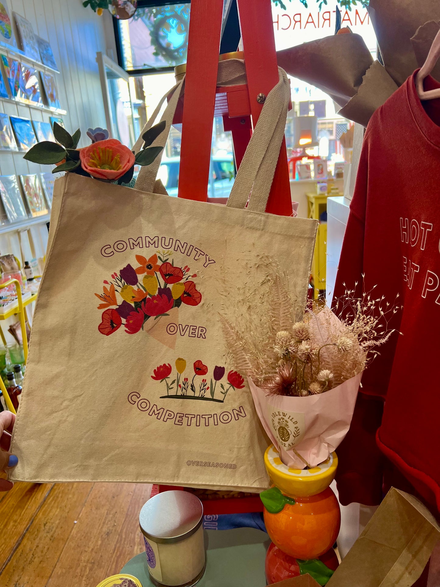Community Over Competition Tote Bag