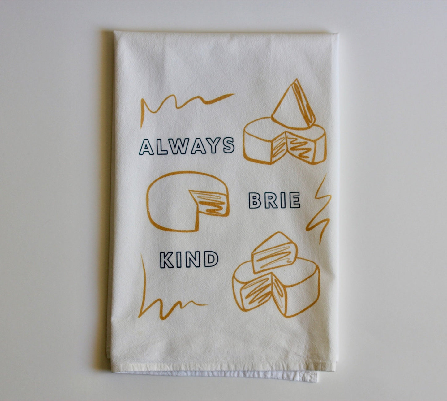White tea towel with cheese design