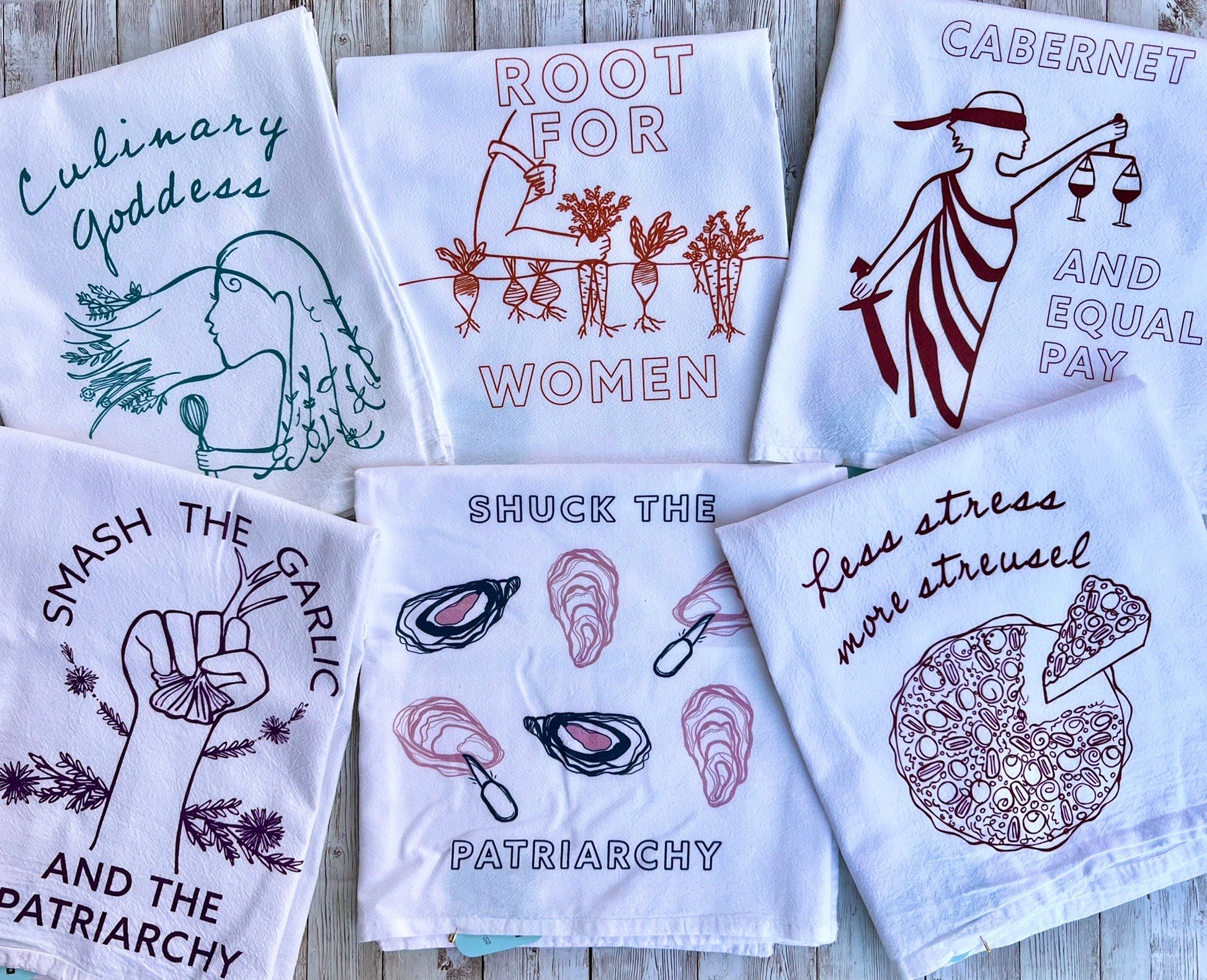 A collection of tea towels with various phrases