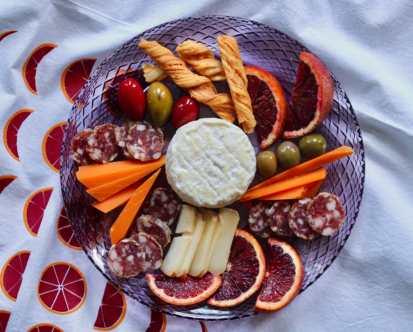 Tea towel with oranges design and charcuterie plate