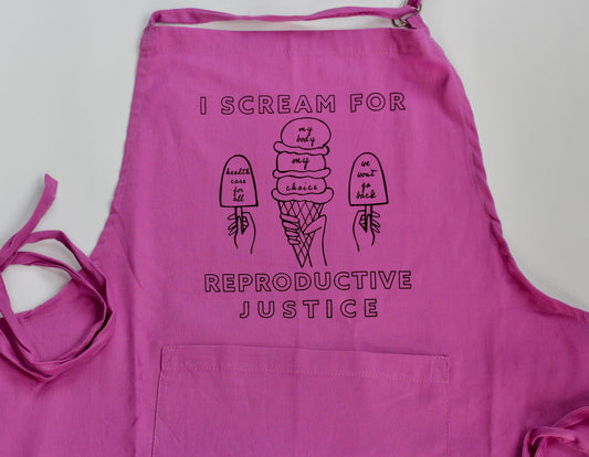 An orchid pink apron with "I Scream for Reproductive Justice" in block letters and ice cream treat illustrations