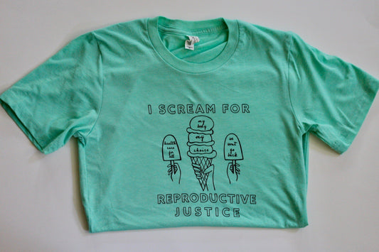 A mint green tee with the words I Scream for Reproductive Justice in black block letters with ice cream illustrations 