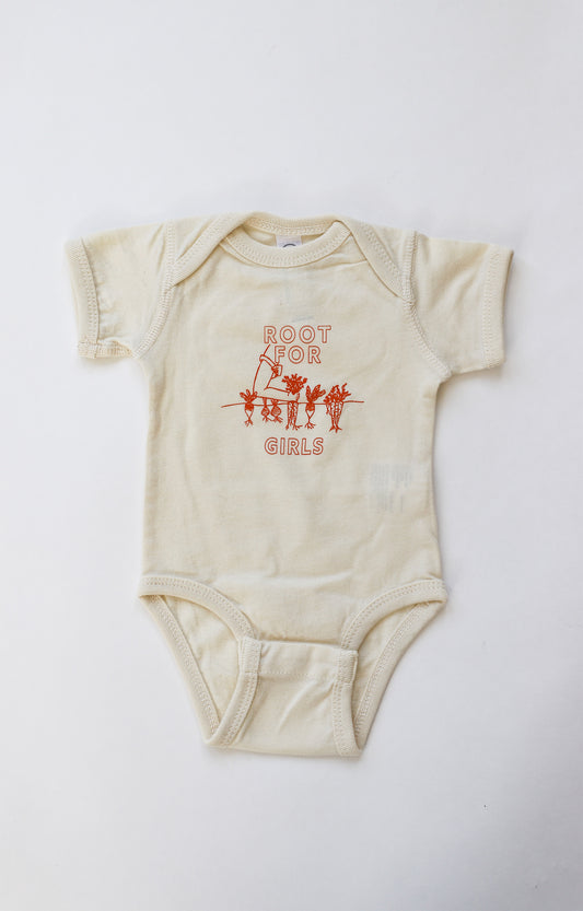 Natural color baby onesie with "Root for Girls" in orange block letters with a garden illustration 