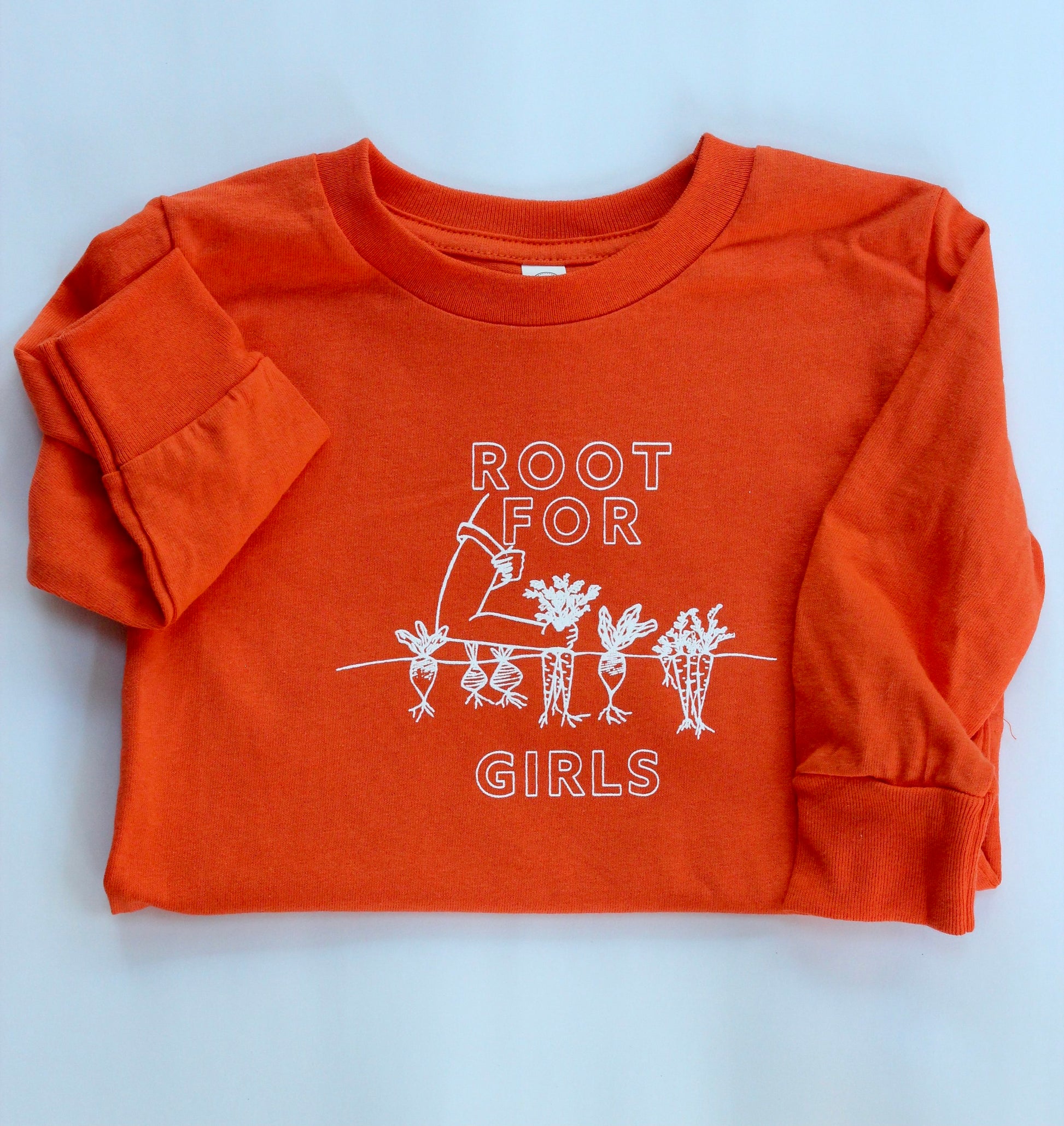 A carrot orange long sleeve toddler tee reads "Root for Girls" with a gardening graphic